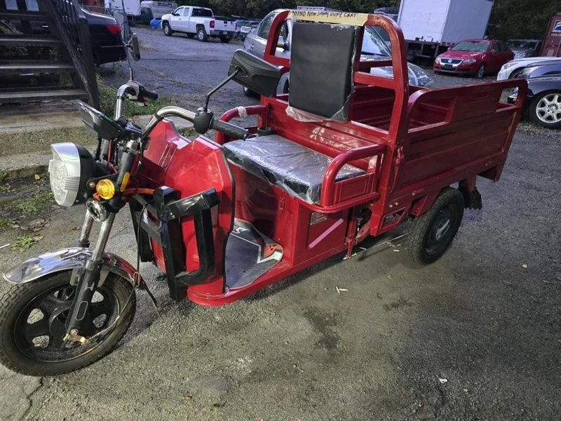 Red 2026 ET13 electric cargo dump tricycle, front-side view with rear cargo bed
